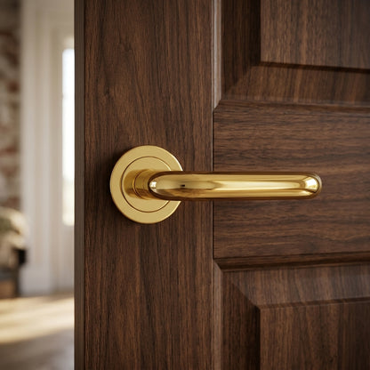 Studio H Lever on Round rose in Polished Brass
